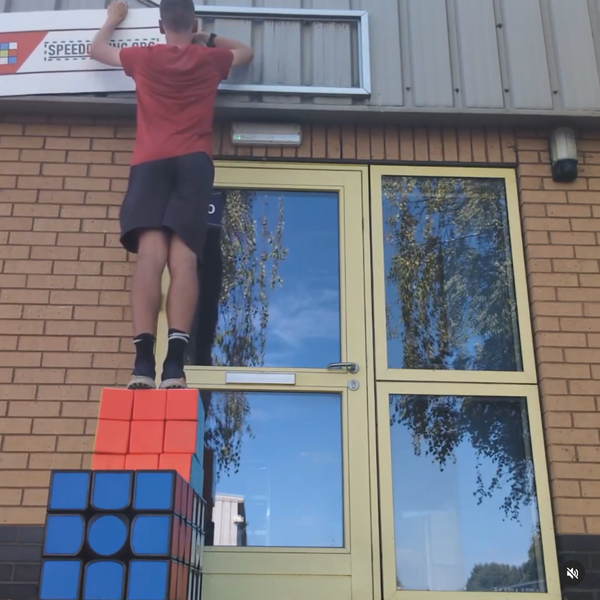 I put up my stall sign (standing on giant cubes)